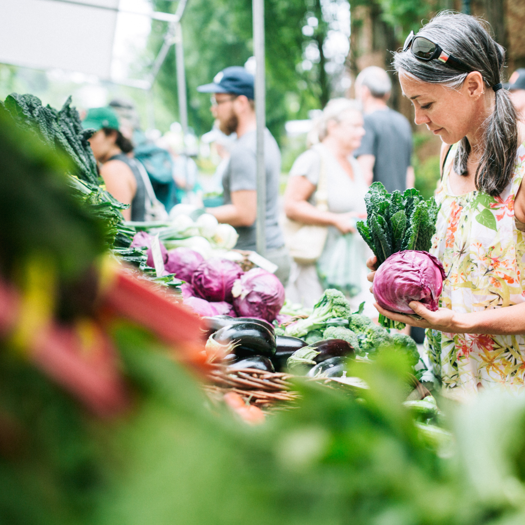 Mental Health Awareness Month 2025 - LES 1 Women browsing at farmers market