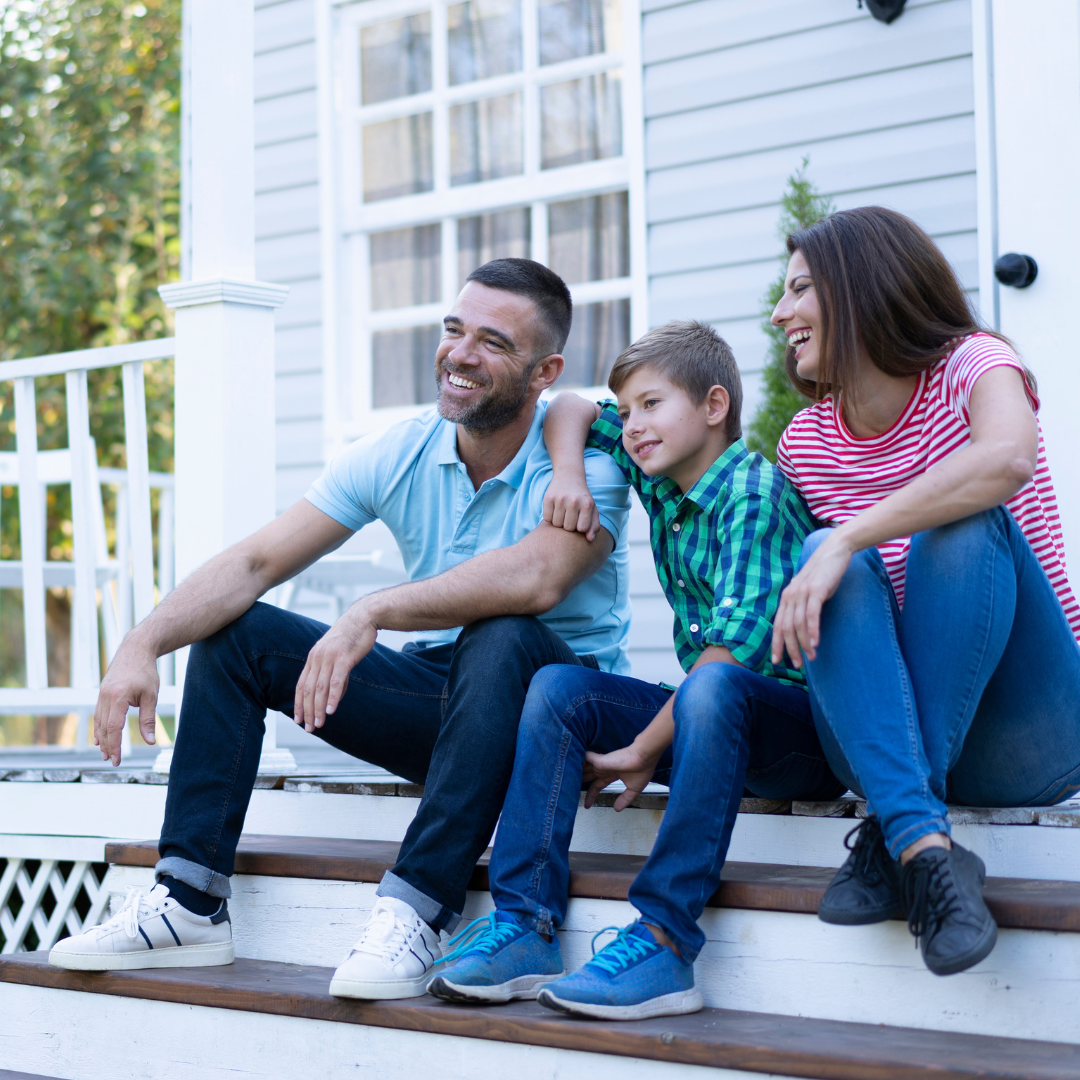 Mental Health Awareness Month 2025 - LES 1 Family in front of house
